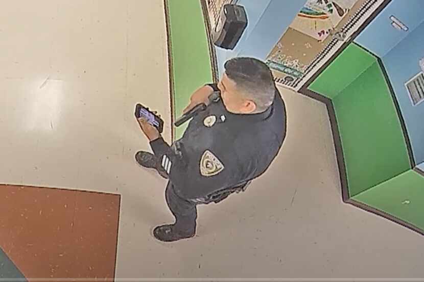 A police officer responding to the mass shooting at Robb Elementary School in Uvalde on May...