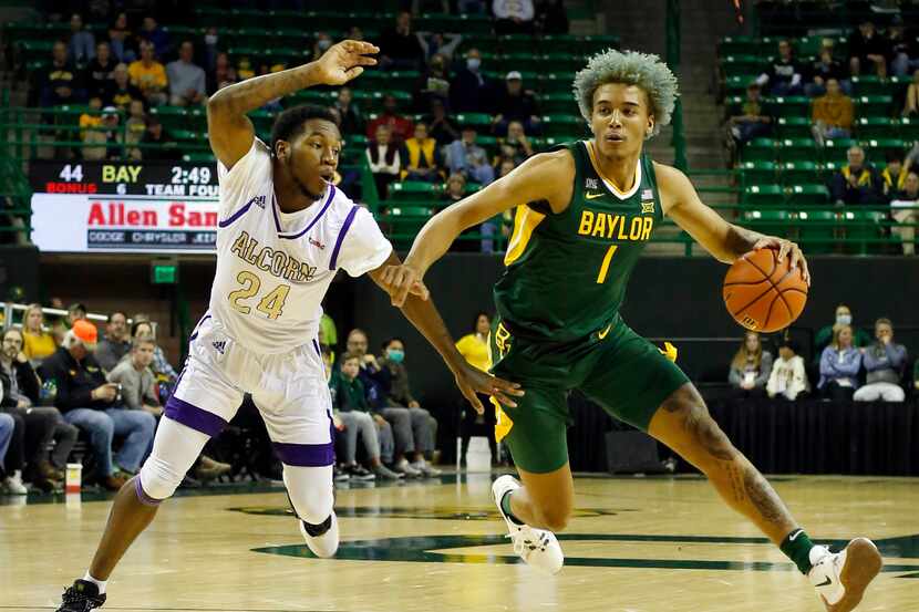 Baylor forward Jeremy Sochan (1) drives past the defense of Alcorn State guard Mike Pajeaud...