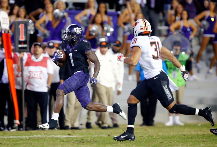 FILE - TCU Horned Frogs wide receiver Jalen Reagor (1) breaks away from Oklahoma State...