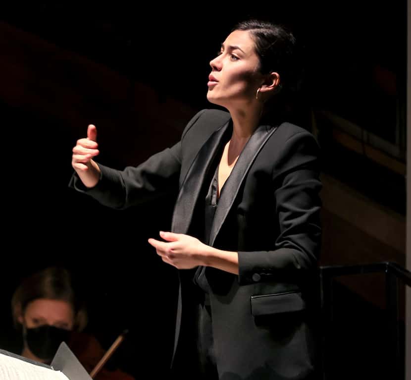 Conductor Celia Llácer Carbonell from Spain leads the Dallas Opera Orchestra at the Hart...