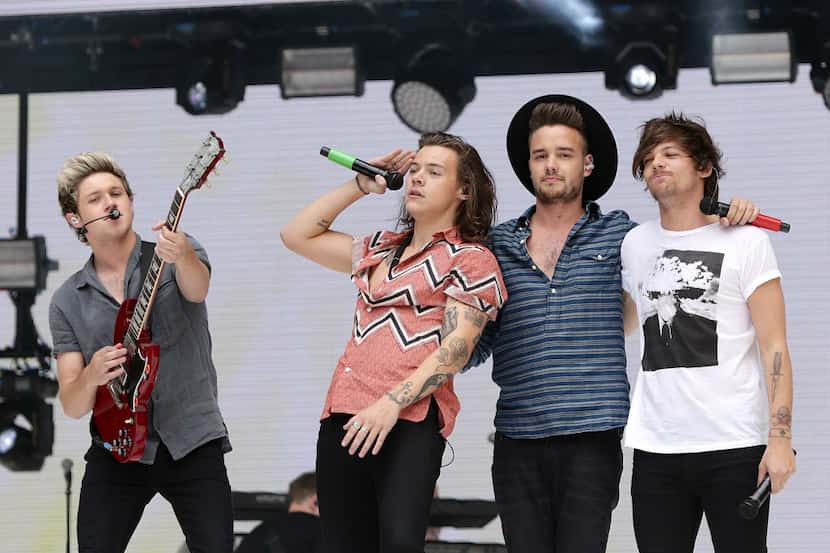 Niall Horan, Harry Styles, Liam Payne and Louis Tomlinson of One Direction perform on stage...