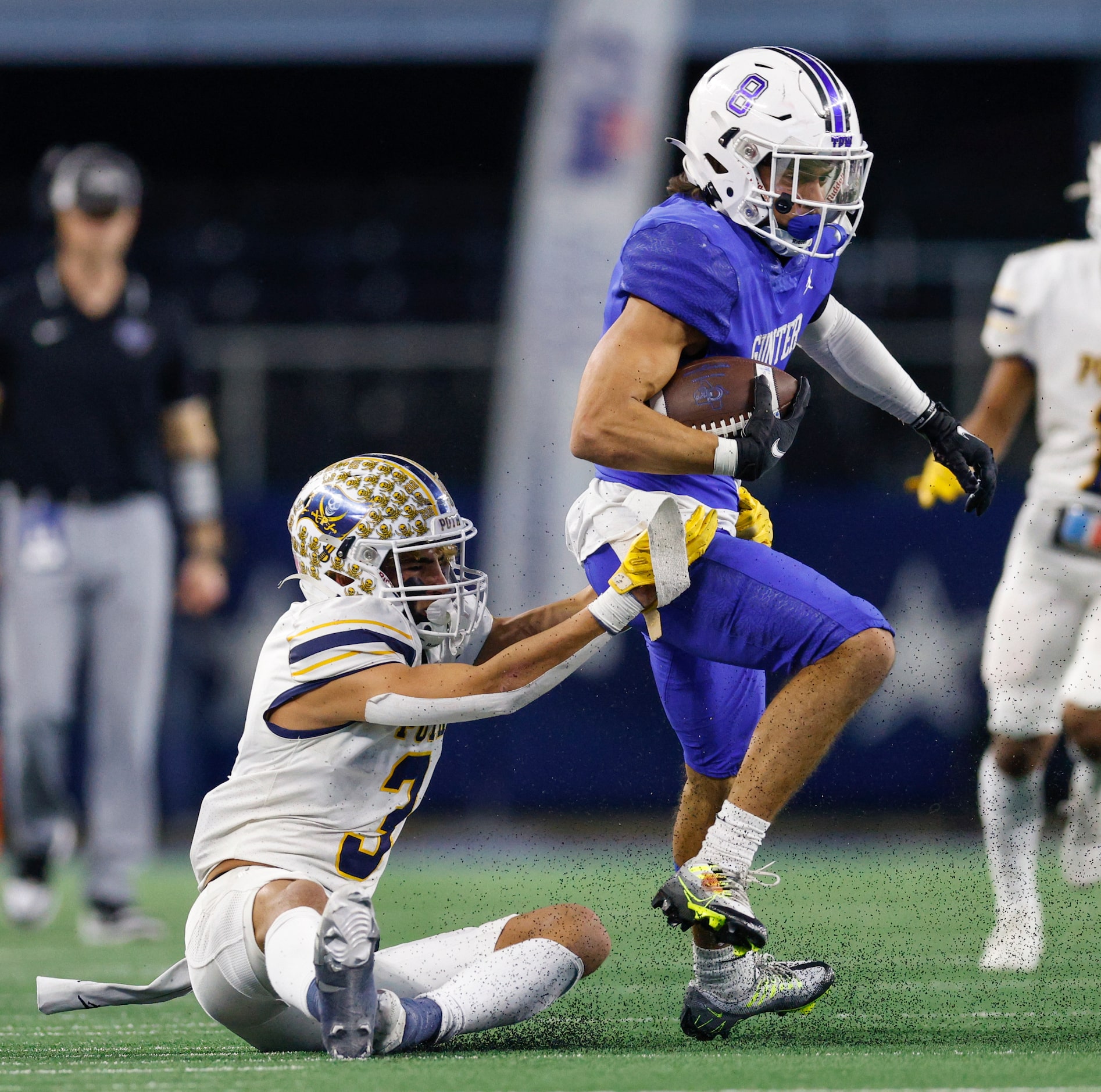 Poth defensive back Gabriel Silansky (3) tackles Gunter running back Ethan Sloan (8) during...