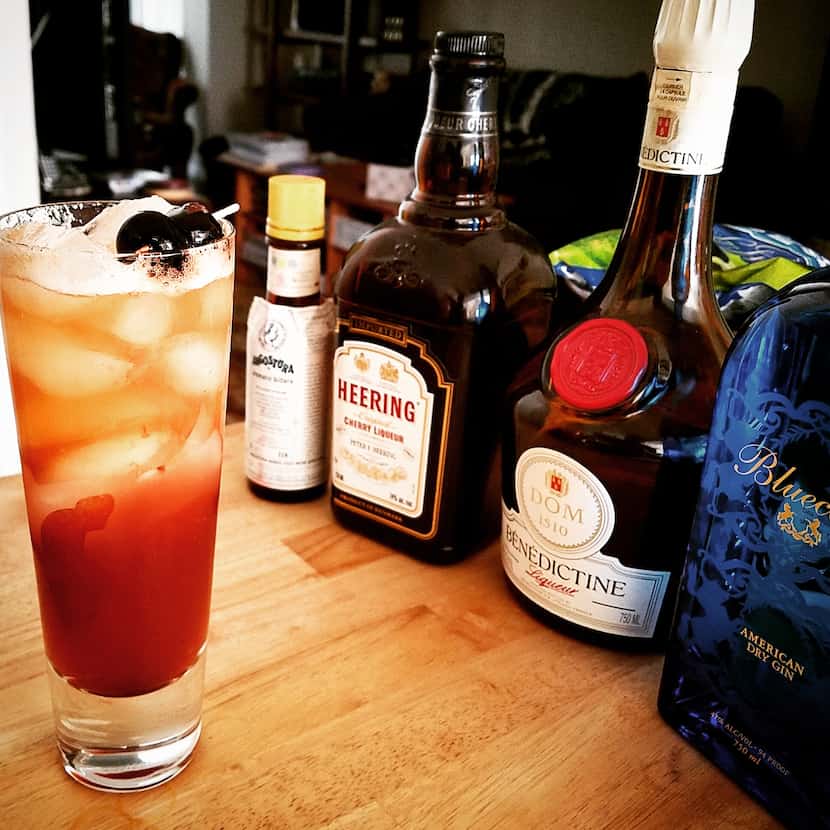 Sling made: Gin, Benedictine, Cherry Heering, lime and a few dashes of bitters, topped with...