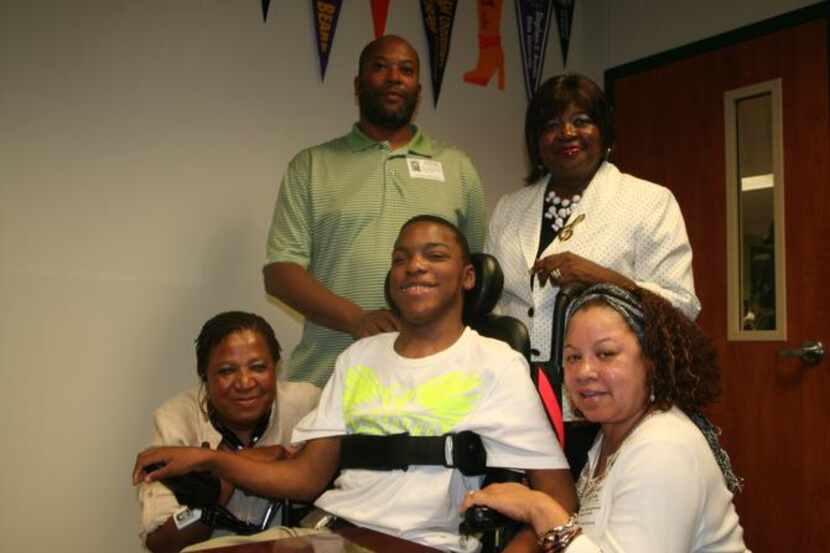 
DeSoto graduate Mark Hiner is surrounded by his support family (from left): foster mother...