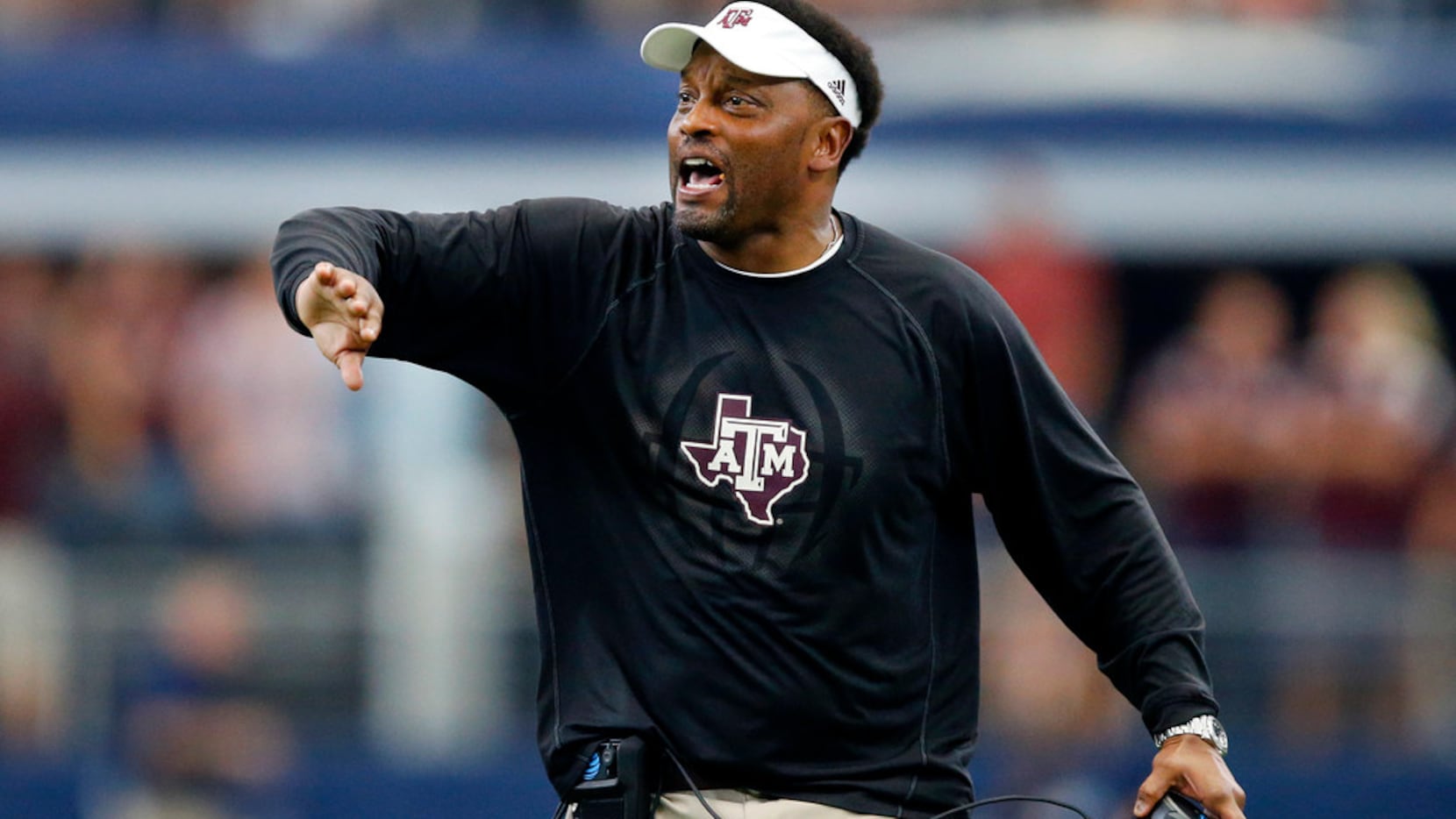 Texas A&M Aggies head coach Kevin Sumlin yells too his offense to stay on the field for a...