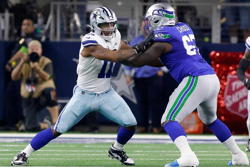Dallas Cowboys linebacker Micah Parsons (11) tries to get around Seattle Seahawks offensive...