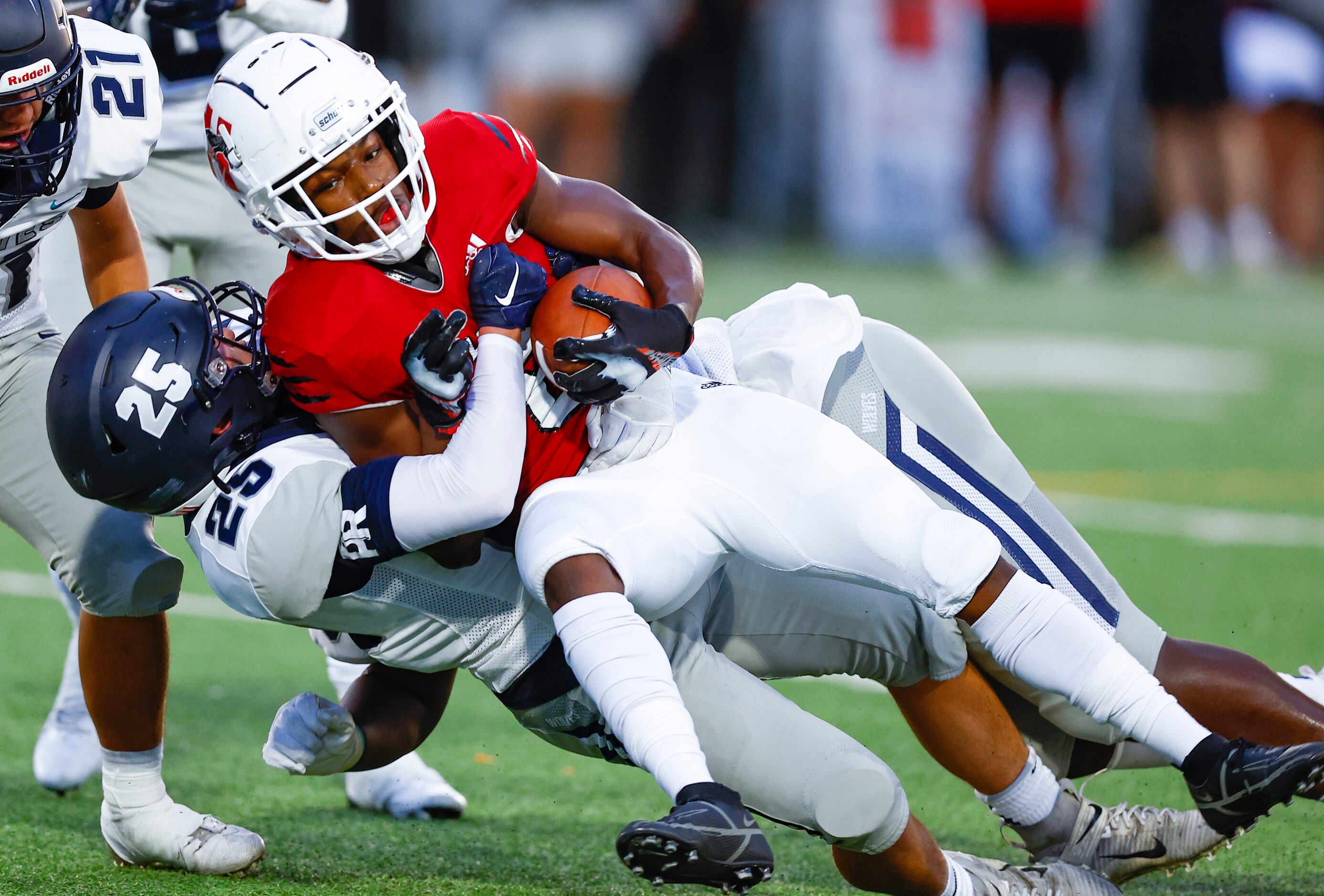 Carrollton Ranchview junior linebacker Julian Huddleston (25) tackles Hillcrest senior...