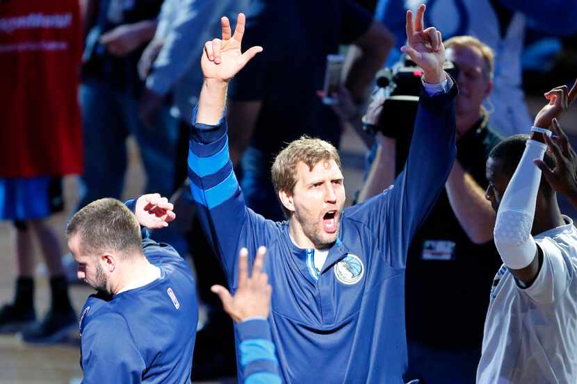 Dallas Mavericks forward Dirk Nowitzki is fired up as he is introduced to fans before their...