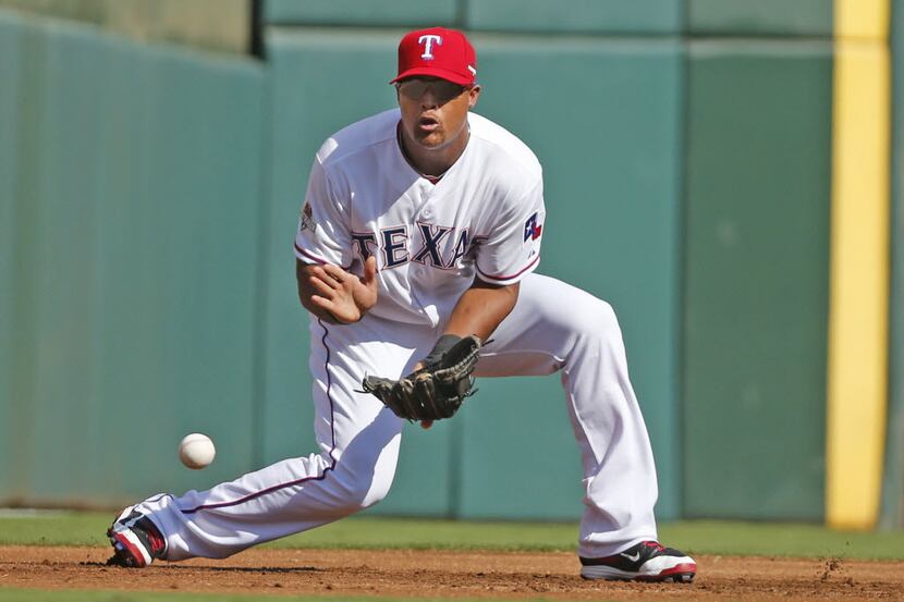 Texas Rangers third baseman Adrian Beltre (29) fields  a grounder by Toronto Blue Jays'...