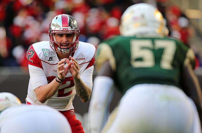 MIAMI, FL - DECEMBER 21:  Brandon Doughty #12 of the Western Kentucky Hilltoppers calls a...