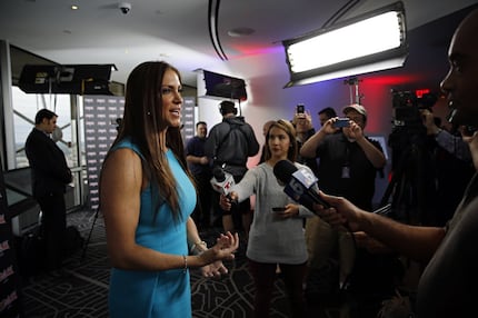 Stephanie McMahon (left), Chief Brand Officer of WWE talks to media during a press event...
