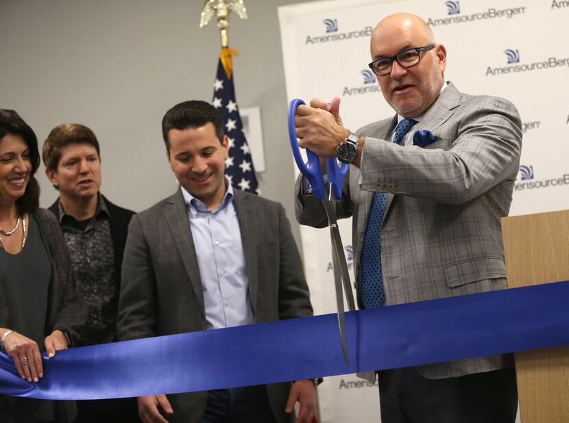 Steve Collis, CEO and president of AmerisourceBergen Corporation, cuts a ceremonial ribbon...