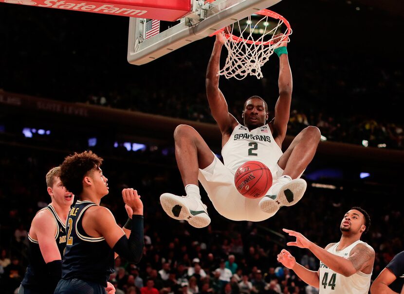 FILE - In this March 3, 2018 file photo, Michigan State forward Jaren Jackson Jr. (2) dunks...