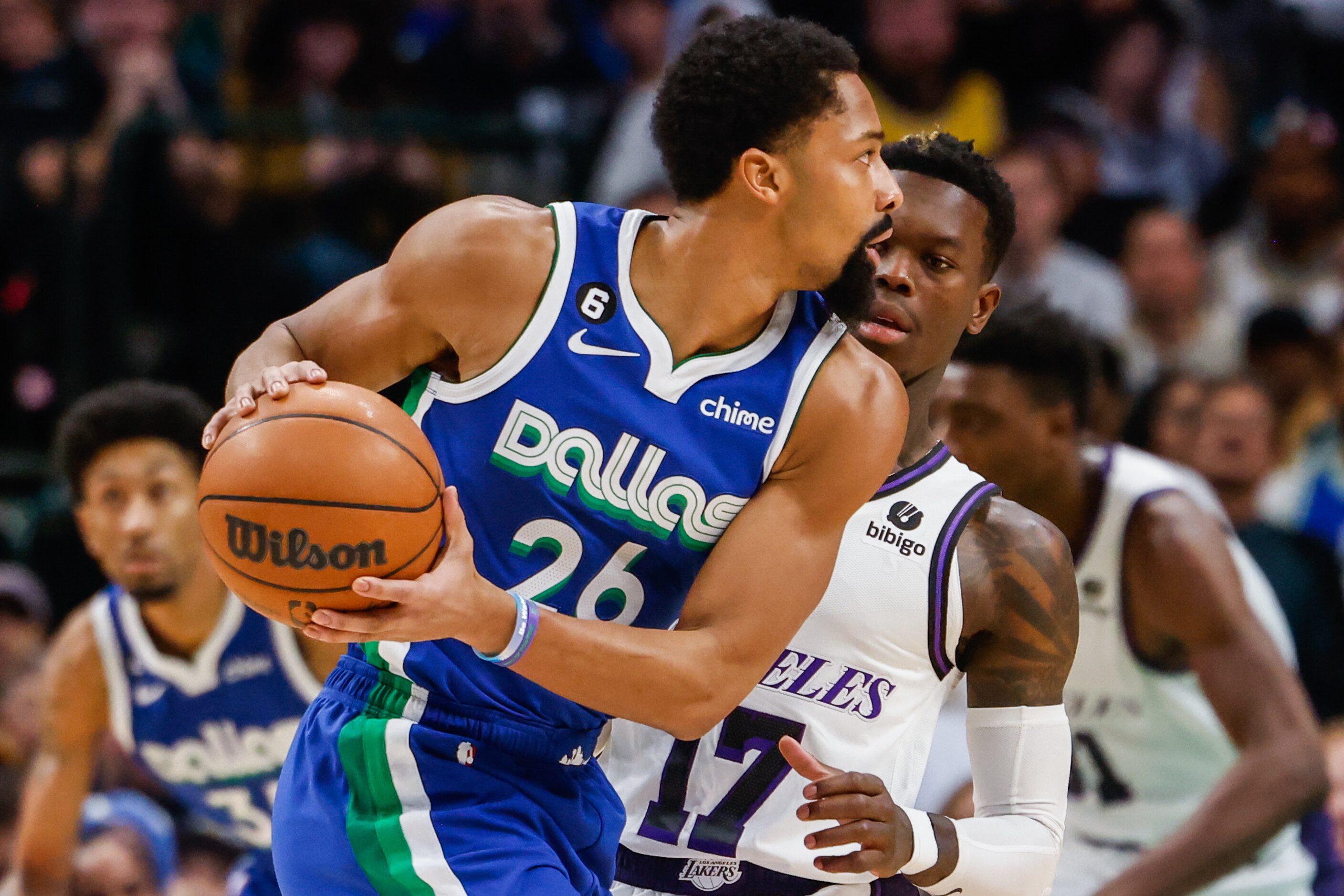 Dallas Mavericks guard Spencer Dinwiddie (26) check the play to pass the basketball as Los...