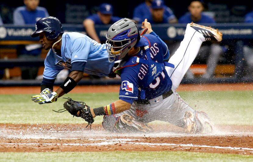 ST. PETERSBURG, FL - JULY 23:  Catcher Robinson Chirinos #61 of the Texas Rangers gets the...