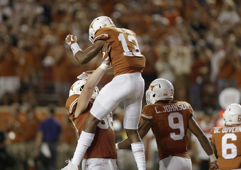 AUSTIN, TX - OCTOBER 07:  Derek Kerstetter #68 of the Texas Longhorns celebrates with Jerrod...