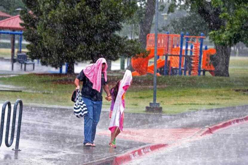 
The downpour at the Mustang Park Recreation Center in Irving had people using whatever they...