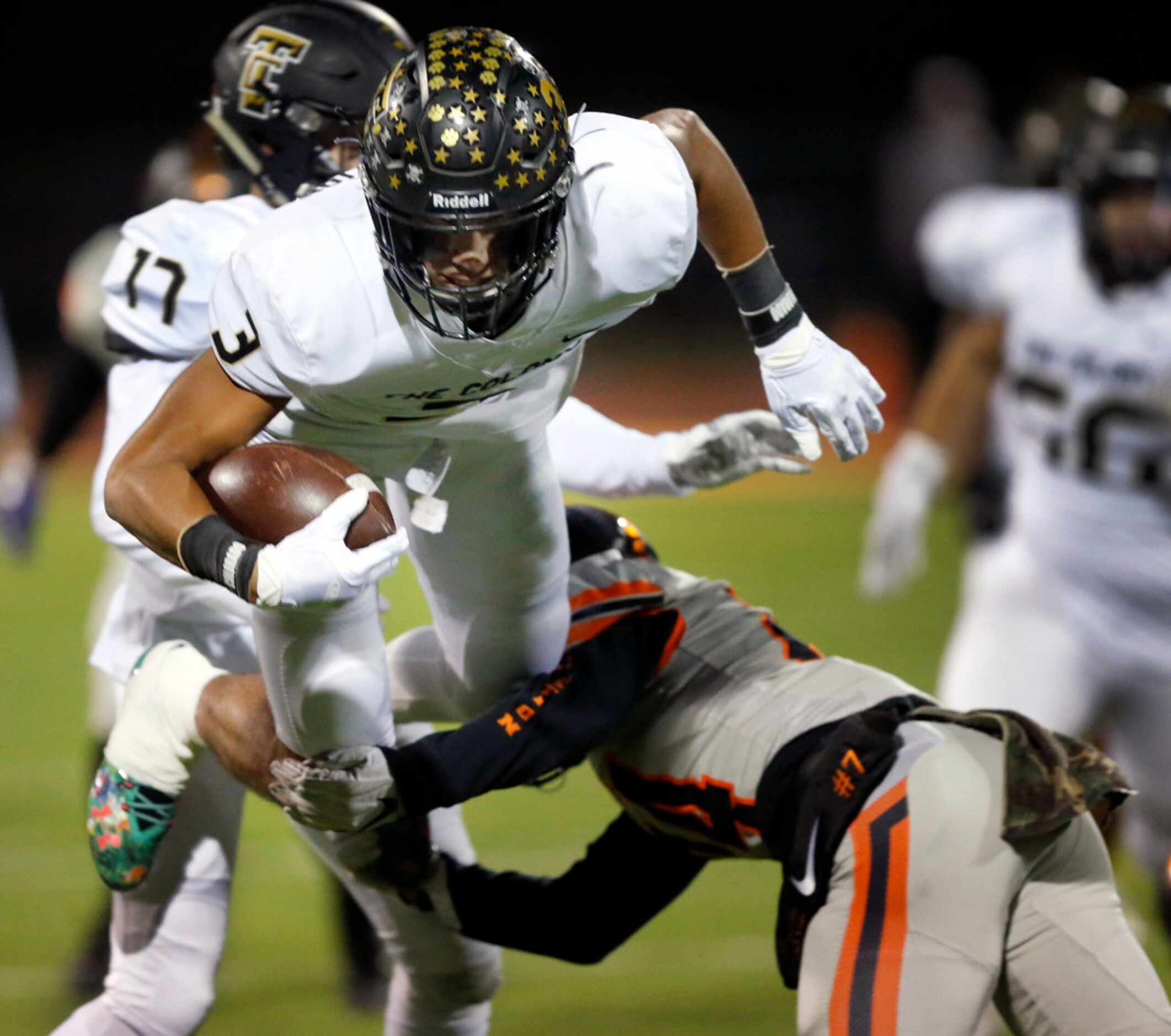 The Colony wide receiver Christian Gonzalez (3) is upended by Lancaster defensive back Andre...