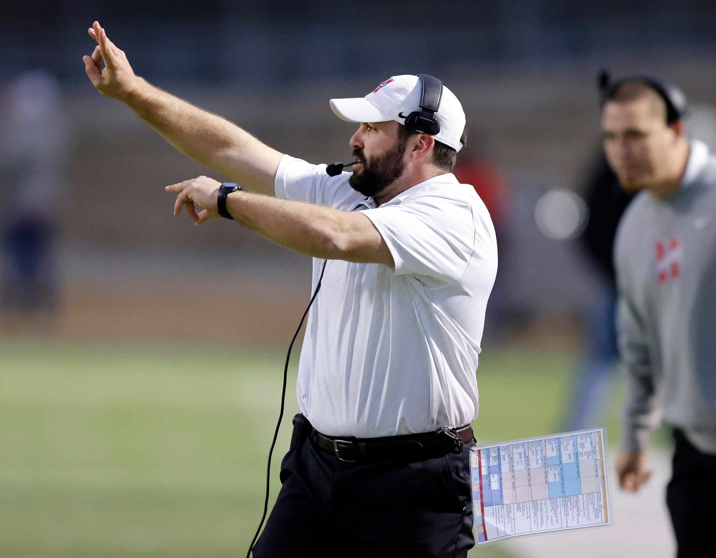 South Oak Cliff Midlothian Heritage head coach Eric Edwards yells instruction to his players...