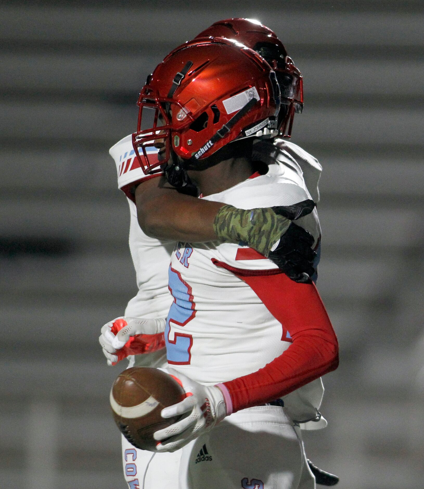 Dallas Carter receiver Niko Johnson (12) receives congratulations from a teammate following...