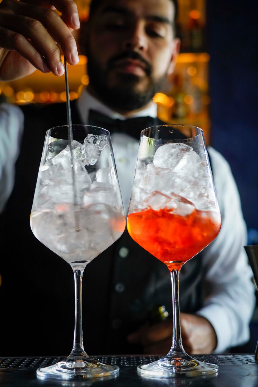 An Aperol Spritz (right) and a Pompelmo Spritz are mixed at Fachini Ristorante.