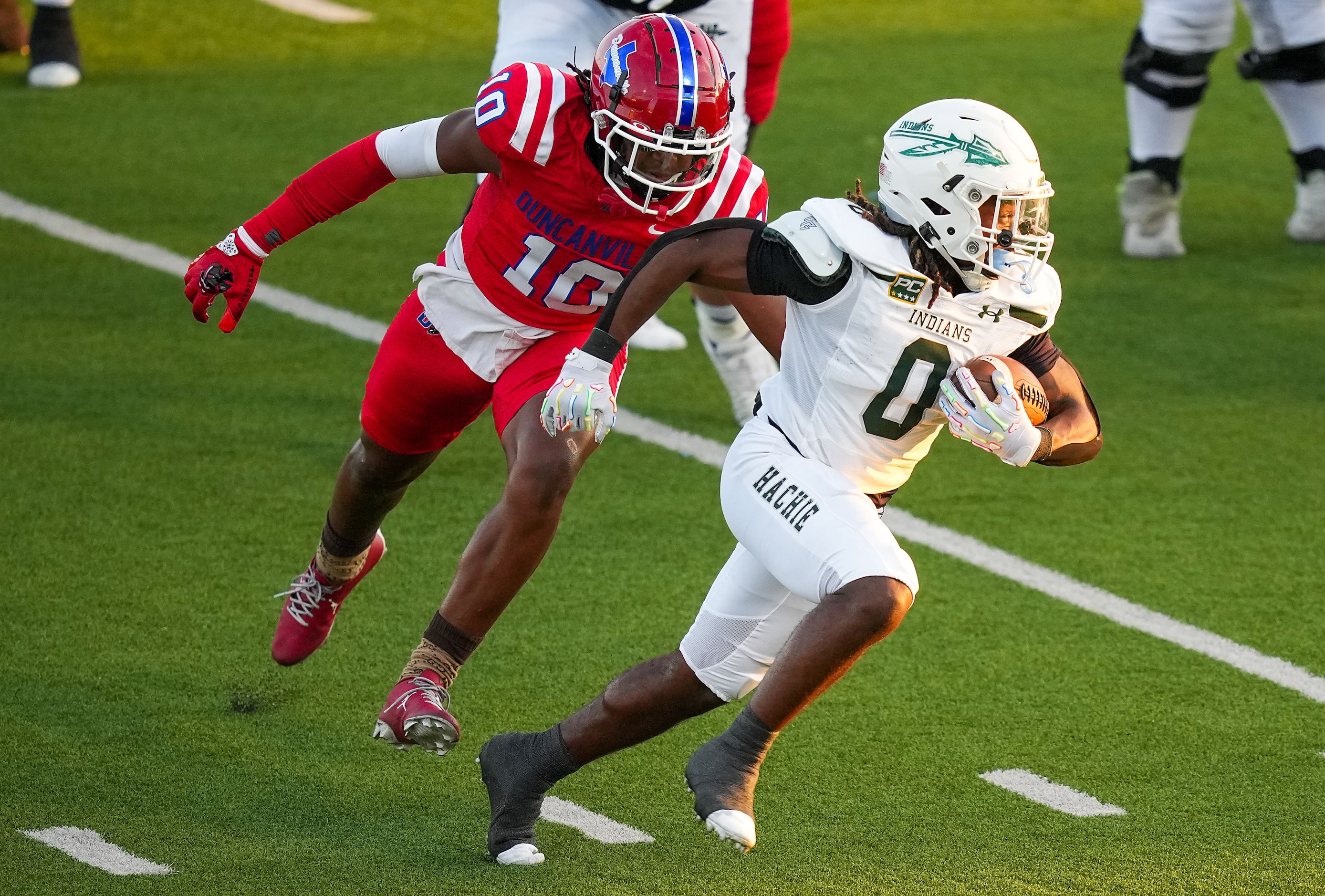 Waxahachie running back Bryson Linnear (0) gets past Duncanville defensive lineman Kevin...