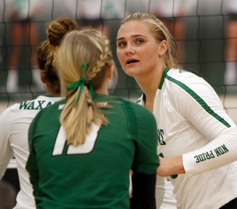 Waxahachie senior outside hitter Audrey Nalls (15) glances toward the team bench following a...