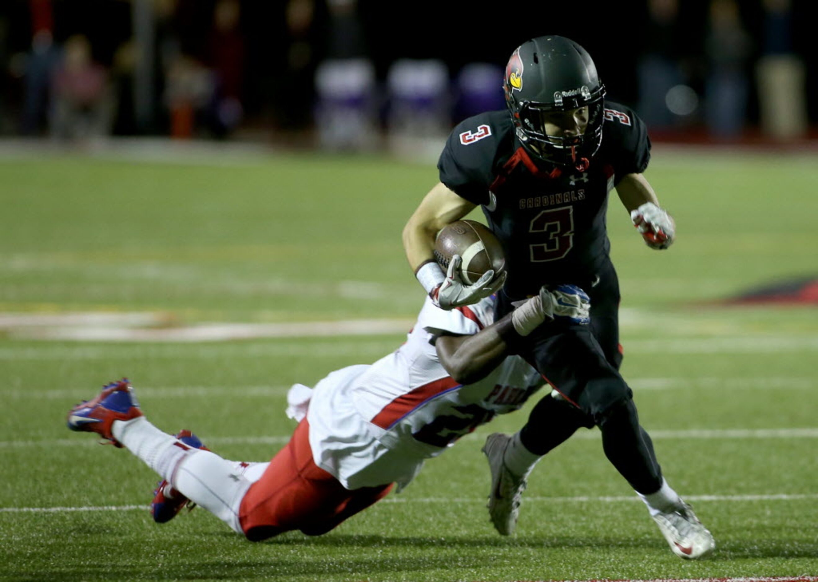 Parish Episcopal’s Bryson Ingrams (20) tackles Fort Worth Christian’s Cade Garcia (3) during...