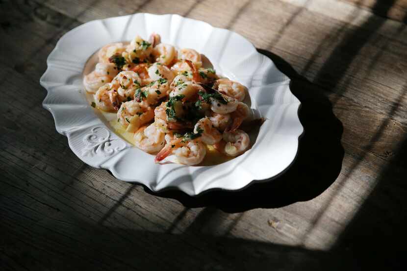 Garlic shrimp is photographed in preparation of a traditional Italian Christmas dinner at...
