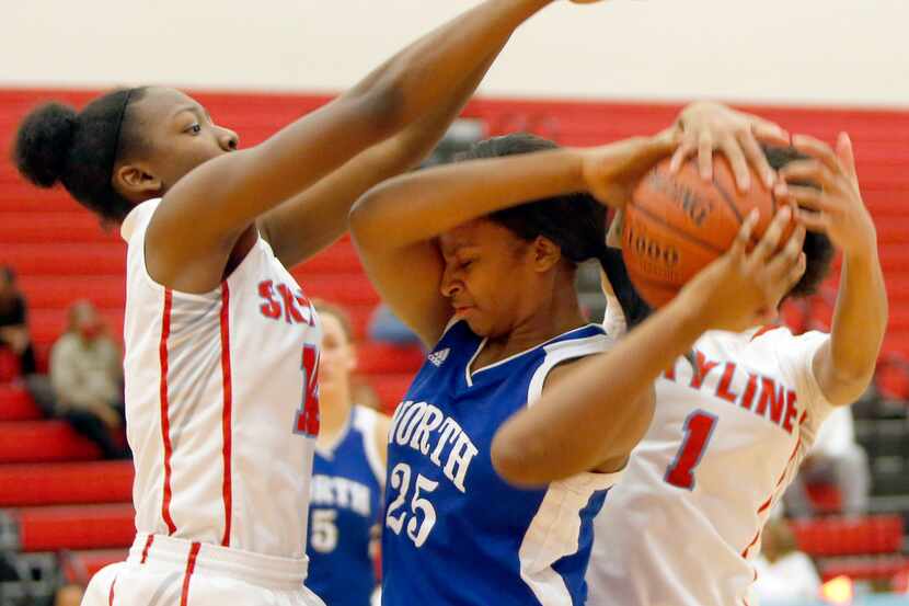 North Mesquite's Keaira Edwards (25) is trapped in the suffocating defense of Skyline's...