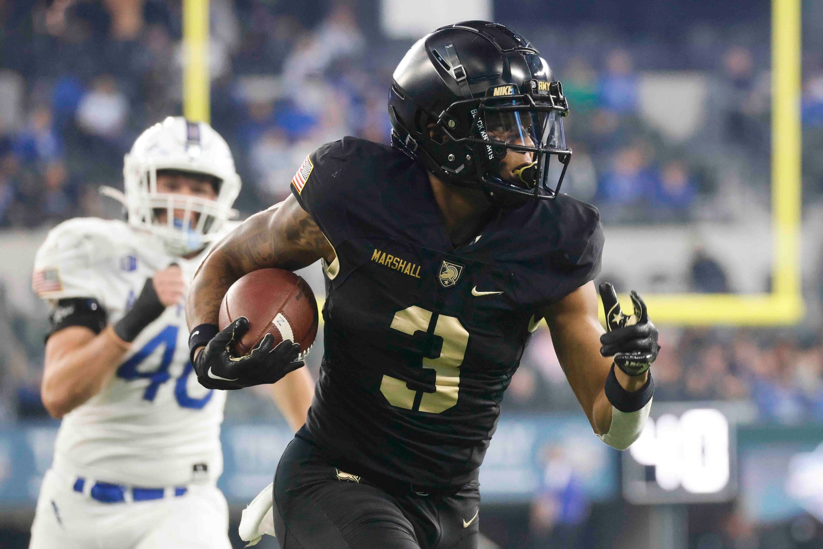 Army running back Ay'Jaun Marshall (3) runs for a yardage against Air Force during the first...