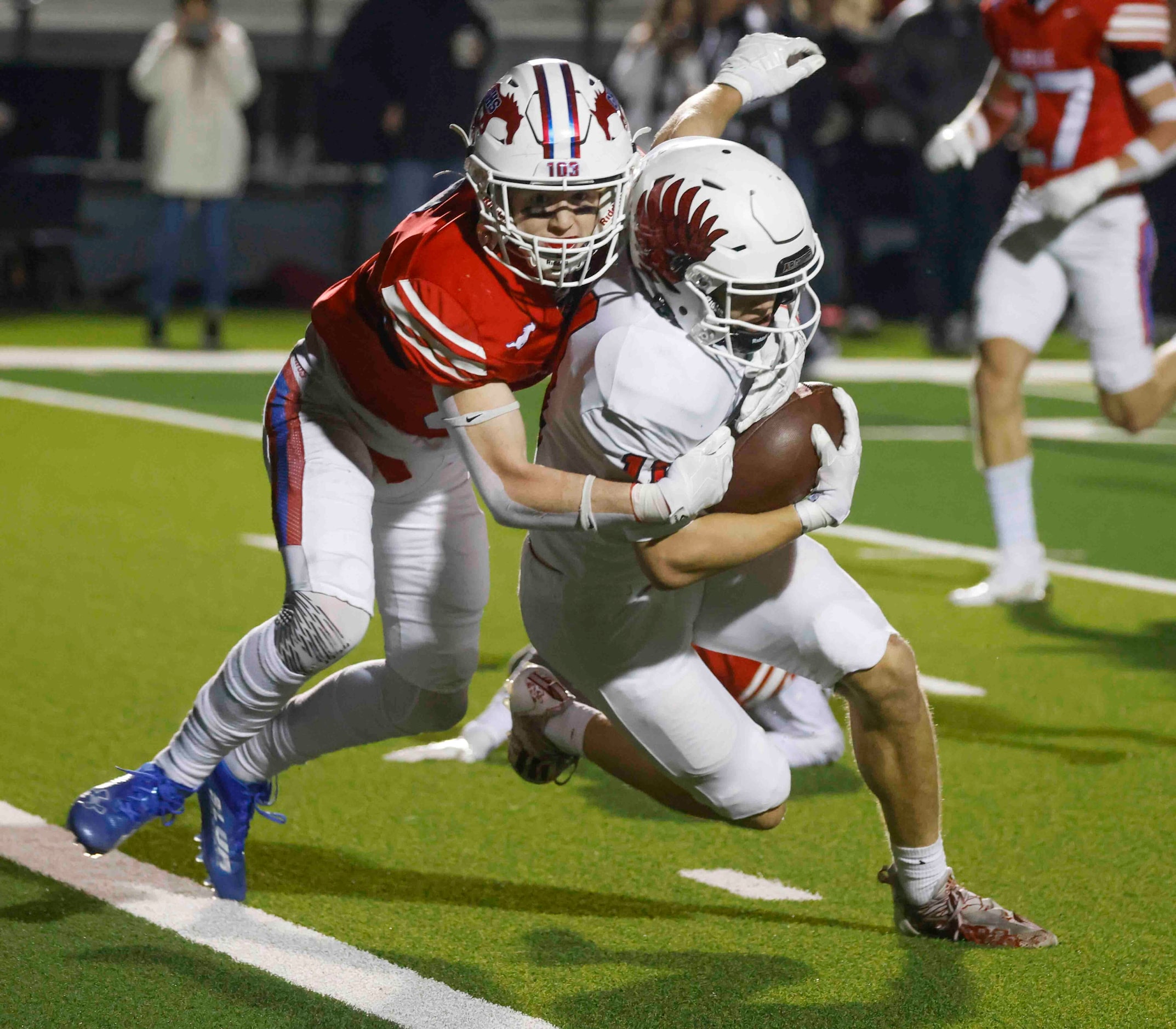 Grapevine High’s Major Heckt (6), left, tackles Argyle High’s RJ Bunnell (11) as he...