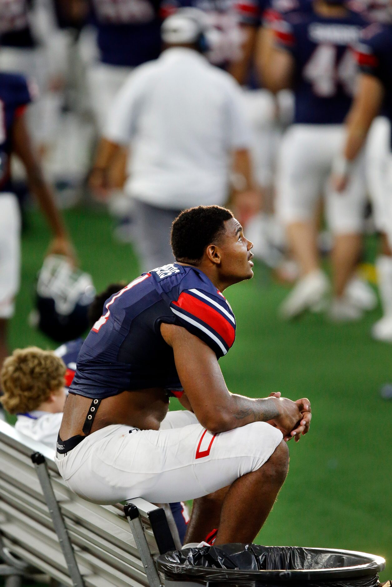 Denton Ryan wide receiver Ja'Tavion Sanders (1) watches the fourth quarter from the bench...