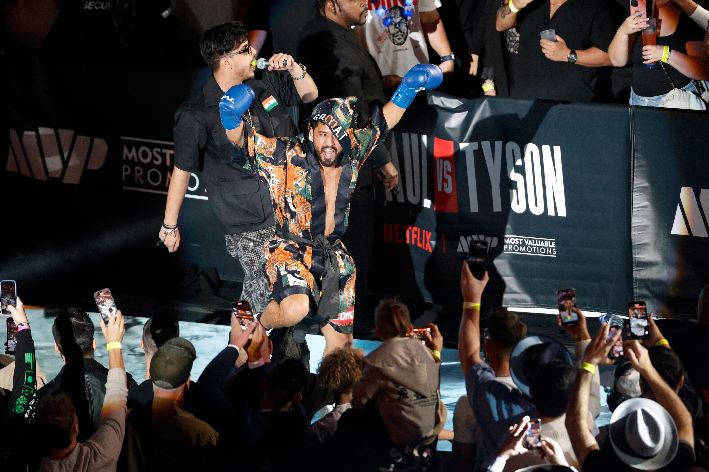 Neeraj Goyat makes his entrance before a super middleweight boxing match against Whindersson...