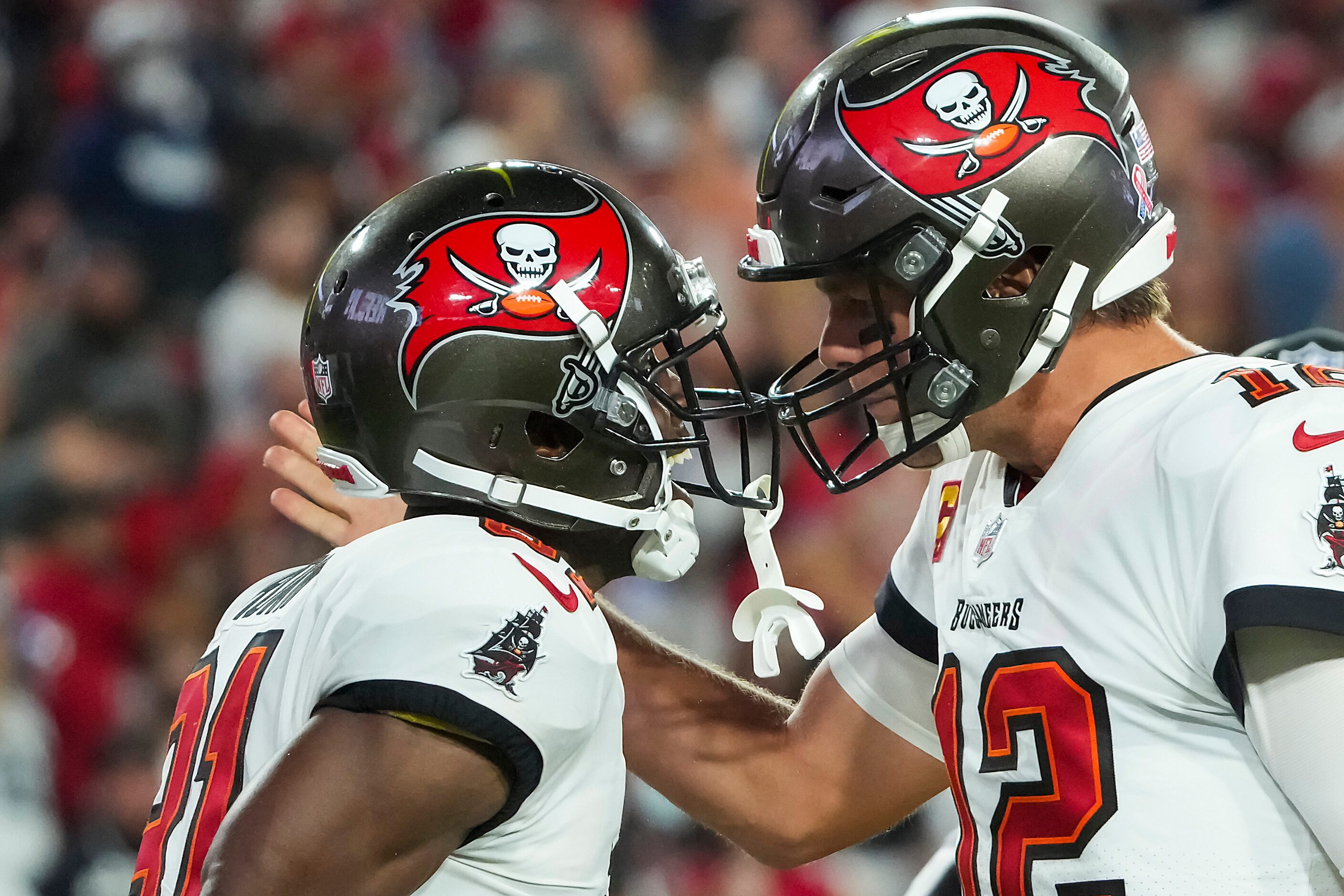 Tampa Bay Buccaneers quarterback Tom Brady (12) celebrates with wide receiver Antonio Brown...