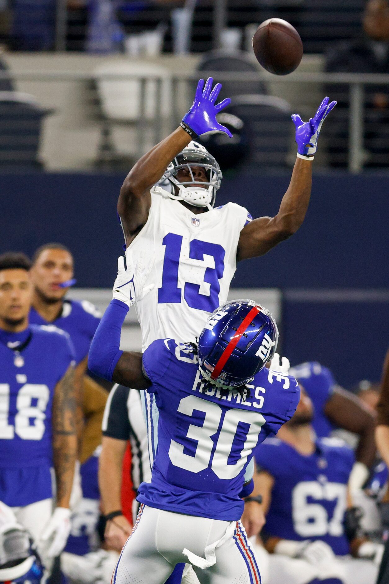 Dallas Cowboys wide receiver Michael Gallup (13) makes a leaping catch over New York Giants...