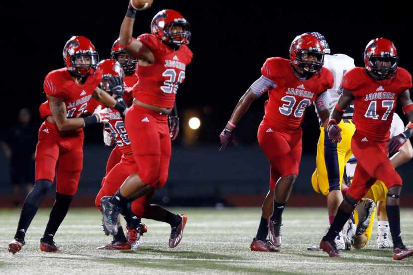 Mesquite Horn High defender Brandon Tennyson (36) jumps up with the ball, after recovering a...