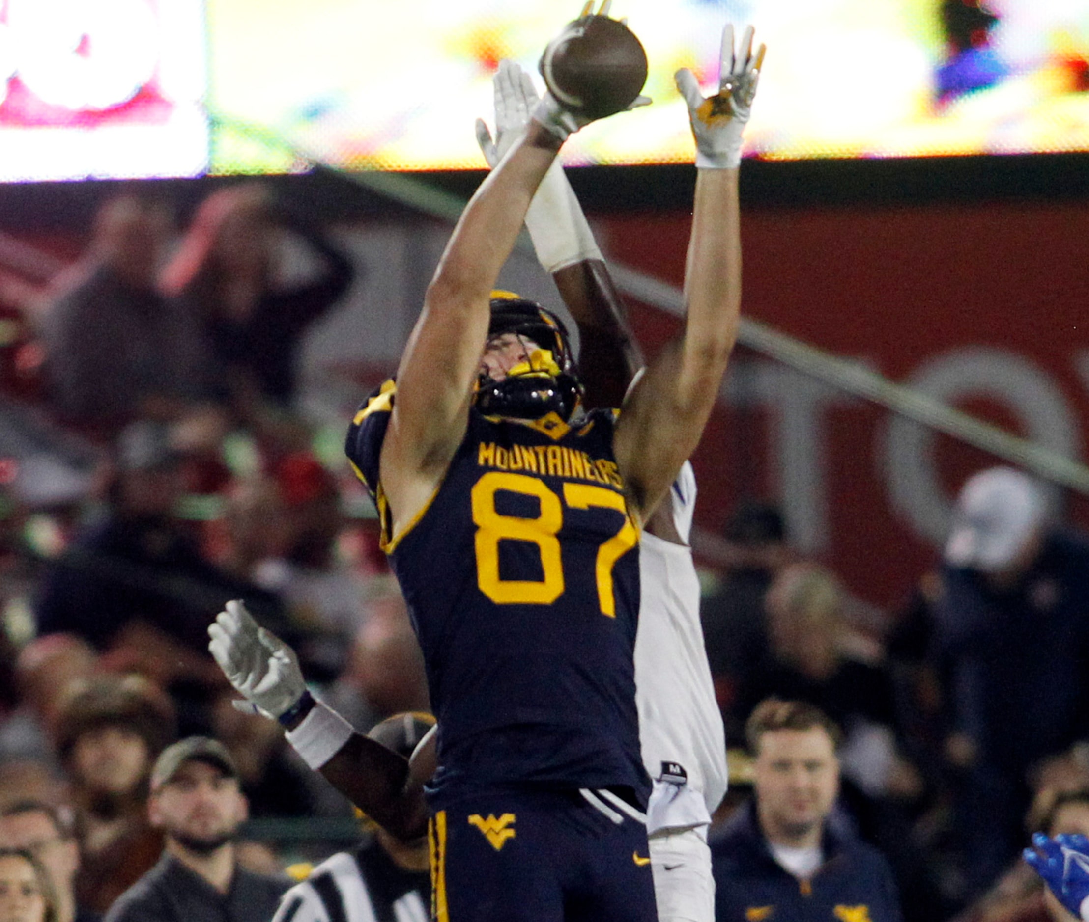 West Virginia tight end Kole Taylor (87) leaps but is unable to pull in a tall pass as he is...