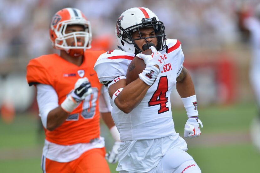 LUBBOCK, TX - SEPTEMBER 12: Justin Stockton #4 of the Texas Tech Red Raiders breaks away for...