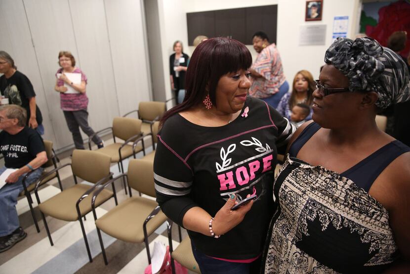 Barbara Edwards, a breast cancer survivor, talks to her friend and fellow survivor Amelia...