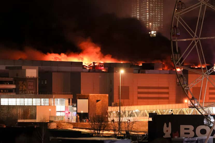 A massive blaze is seen over the Crocus City Hall on the western edge of Moscow, Russia,...