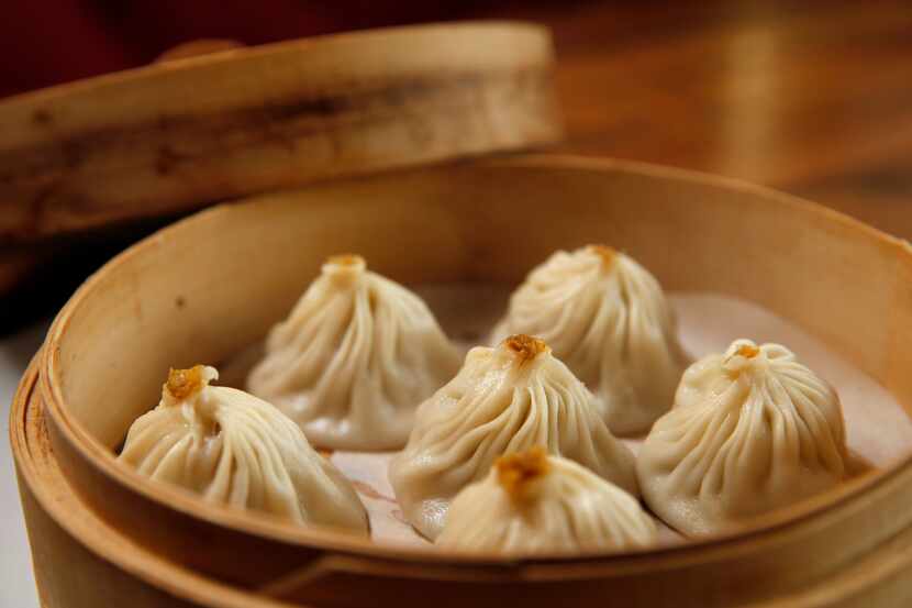 Steamed pork and crabmeat juicy dumplings — soup dumplings, or xiao long bao — are among 10...