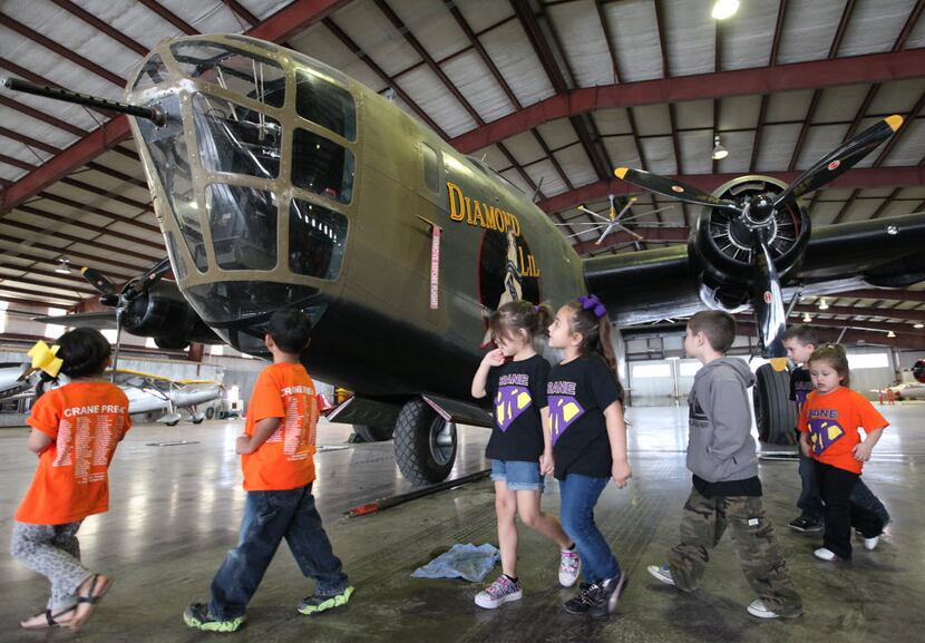 Elementary students from Crane marveled at "Diamond Lil," one of only two B-24 planes that...