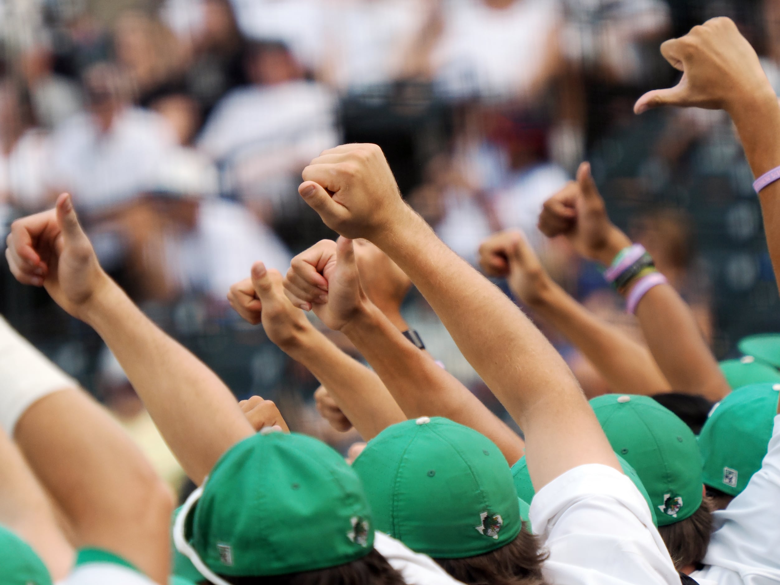 Southlake Carroll players react in the dugout after a strikeout against San Antonio Reagan...