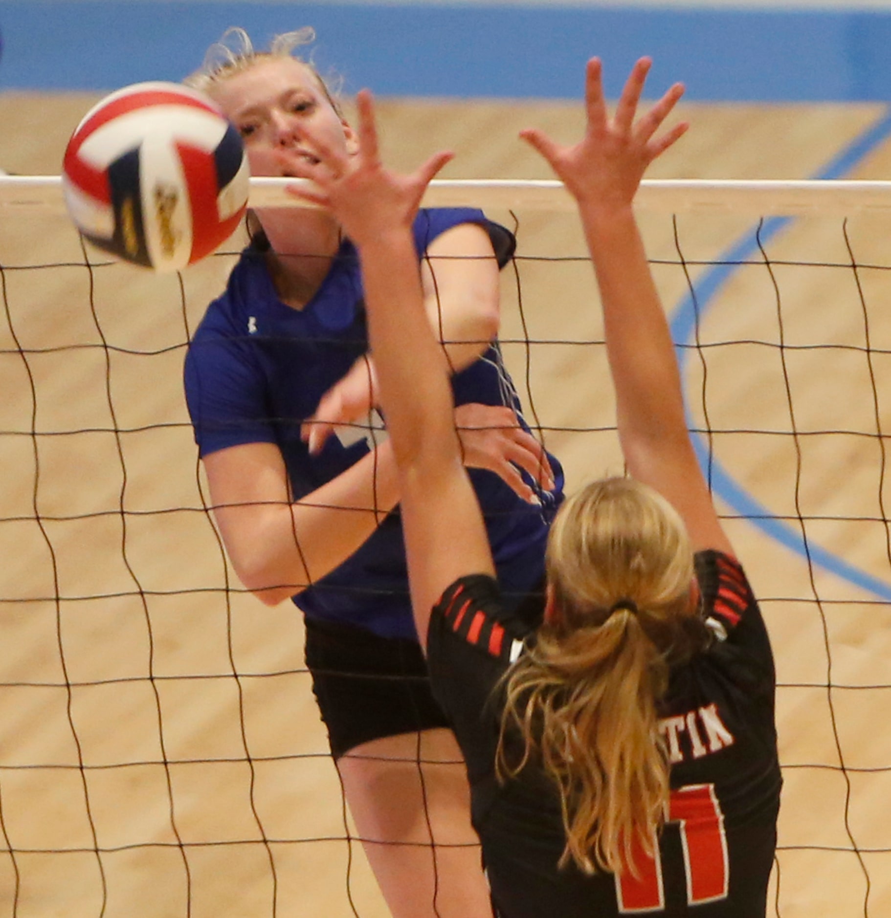 Denton Guyer's Brooke Slusser (4) sneaks a shot past the defense of Arlington Martin...