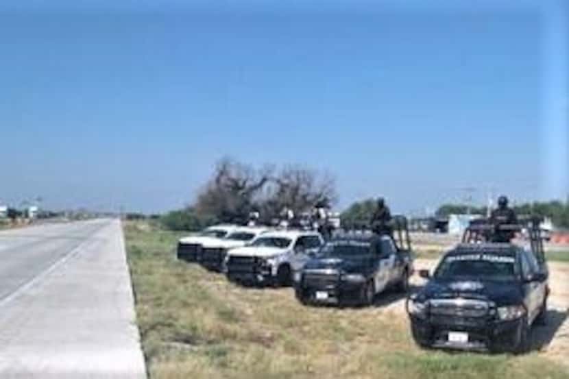 Police in Mexico monitor the highway between Monterrey and Nuevo Laredo.