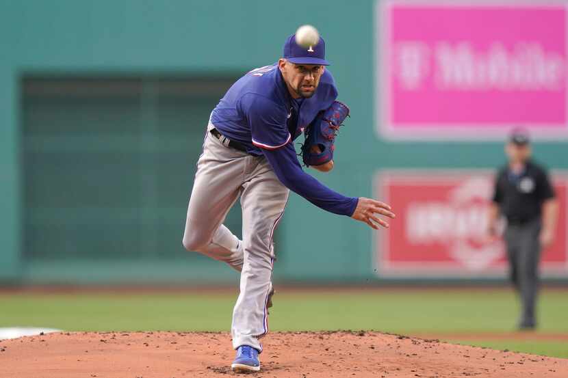 Texas Rangers' Nathan Eovaldi delivers a pitch to a Boston Red Sox batter during the first...