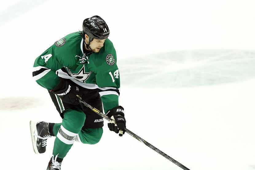 Dallas Stars left wing Jamie Benn (14) skates with the puck against the Anaheim Ducks in the...