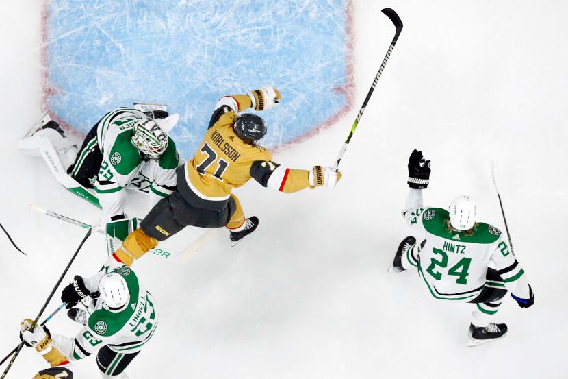 Dallas Stars center Roope Hintz (24) catches the puck as Vegas Golden Knights center William...