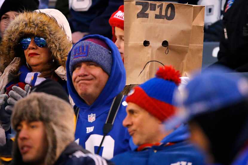 New York Giants fans react to their team losing in the fourth quarter against the Dallas...